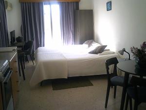 Postel nebo postele na pokoji v ubytování Panklitos Tourist Apartments + 32 fotografií