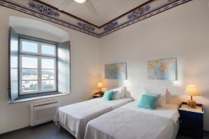A bed or beds in a room at Villa 1853-Upper floor