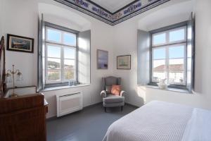A bed or beds in a room at Villa 1853-Upper floor
