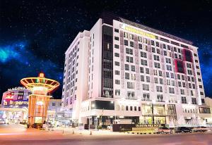 a large building in a city at night at Nagoya Hill Hotel Batam in Nagoya