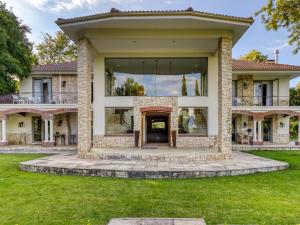 a house with a large window on the front of it at Bonne Chance Luxury Estate in Lynedoch