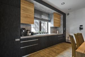a kitchen with a counter and a window at CHALET NEBO in Bukovel