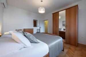 Postel nebo postele na pokoji v ubytování Antares Apartments