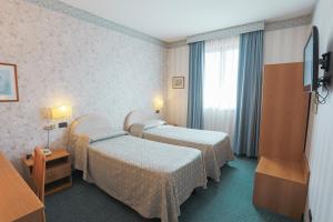 Postel nebo postele na pokoji v ubytování Hotel Ristorante La Lanterna
