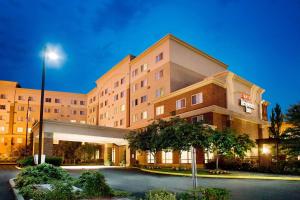 a hotel building with a parking lot in front of it at Residence Inn Seattle East/Redmond in Redmond