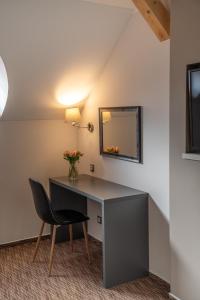 Telewizja i/lub zestaw kina domowego w obiekcie Hotel Grunt