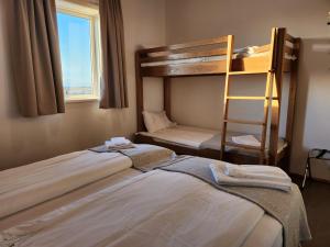 Voodi või voodid majutusasutuse Álftröð Guesthouse toas