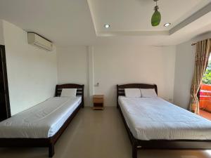 Postel nebo postele na pokoji v ubytování Relaxation guesthouse