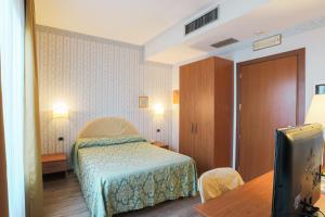 Postel nebo postele na pokoji v ubytování Hotel Ristorante La Lanterna