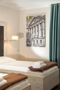 Łóżko lub łóżka w pokoju w obiekcie Hotel Grunt