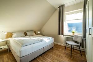 Postel nebo postele na pokoji v ubytování Haus Am Anker Wohnung 7