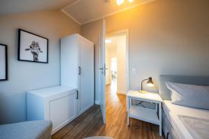 Postel nebo postele na pokoji v ubytování Haus Am Anker Wohnung 7