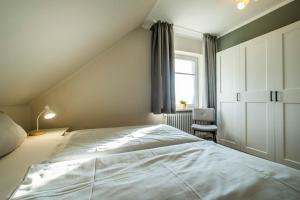 Postel nebo postele na pokoji v ubytování Haus Am Anker Wohnung 7