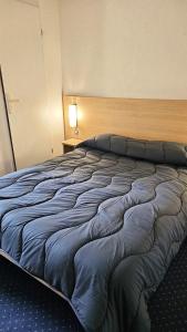 Un ou plusieurs lits dans un hébergement de l'établissement Mister Bed Lomme