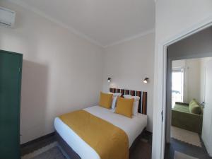 Ein Bett oder Betten in einem Zimmer der Unterkunft Suite Balima XI