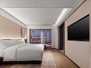 TV a/nebo společenská místnost v ubytování DoubleTree by Hilton Weihai
