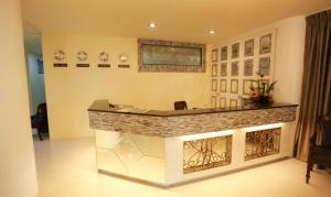 a lobby with a reception desk in a building at Ongville Hotel & Events Place in Candelaria