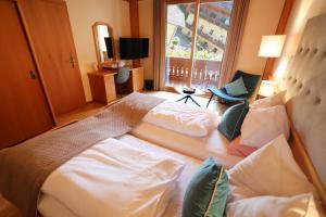 Postel nebo postele na pokoji v ubytování Hotel Zollner