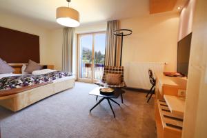 Postel nebo postele na pokoji v ubytování Hotel Zollner