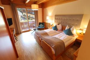 Postel nebo postele na pokoji v ubytování Hotel Zollner