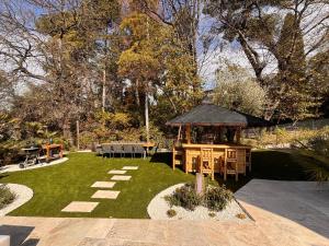 a garden with a gazebo and a picnic table at Luxury Riviera Villa* short walk to beach & center in Cagnes-sur-Mer