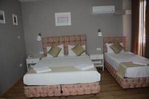 A bed or beds in a room at Hotel Dream Of Side