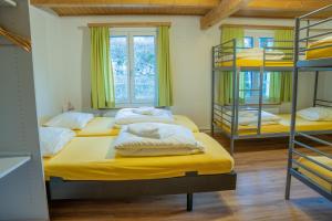 Letto o letti in una camera di juhui Flumserberg