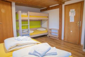 Letto o letti in una camera di juhui Flumserberg