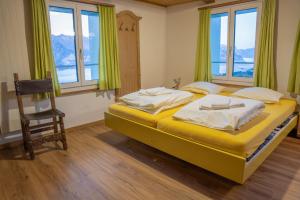 Letto o letti in una camera di juhui Flumserberg