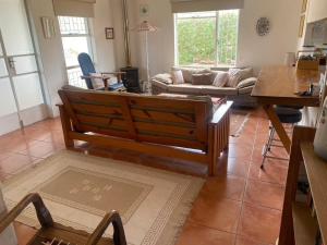 a living room with a couch and a table at lagoon value ! in Langebaan +12 photos