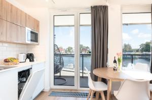 Kuchyň nebo kuchyňský kout v ubytování Apartament Lighthouse 06 SurfingBird Mrzeżyno
