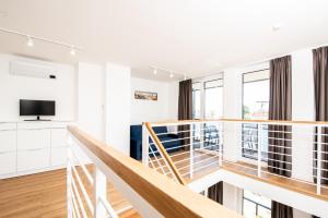 TV a/nebo společenská místnost v ubytování Apartament Lighthouse 06 SurfingBird Mrzeżyno