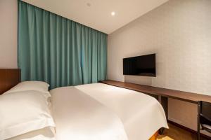 Postel nebo postele na pokoji v ubytování Pami hotel