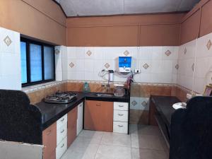 Η κουζίνα ή μικρή κουζίνα στο AARAMGHAR-Perfect Guest House