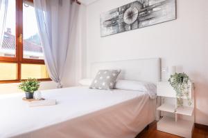 Ένα ή περισσότερα κρεβάτια σε δωμάτιο στο Apartamento la Riberuca con piscina +10 φωτογραφίες