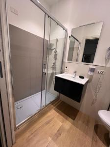 a bathroom with a sink and a shower at Handy in Brindisi +53 photos