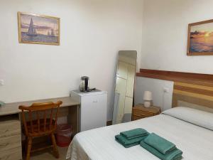 Postel nebo postele na pokoji v ubytování Rivazzurra