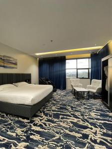 Postel nebo postele na pokoji v ubytování فندق قمم بارك Qimam Park Hotel 6 + 37 fotografií