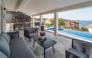 a living room with a couch and a table at Villa Miracle in Split