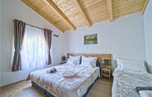 a bedroom with two beds and a window at Nice Home In Licka Jesenica With Sauna in Lička Jesenica