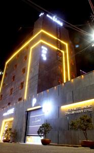 a building with lights on top of it at night at Jeonju Lime Hotel in Jeonju