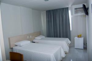 Cama o camas de una habitación en Hotel Arezzu
