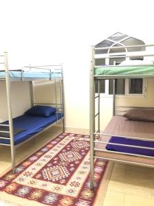 Postelja oz. postelje v sobi nastanitve Heritage Hostel Muscat