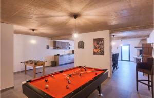 a living room with a pool table and a kitchen at Villa Dolcea in Umag +49 photos