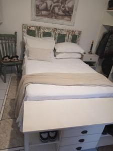 Ένα ή περισσότερα κρεβάτια σε δωμάτιο στο Casa Confortável