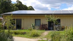 a house with solar panels on the roof at FerienhausLychen in Lychen