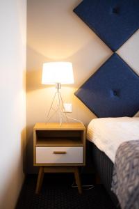 Postel nebo postele na pokoji v ubytování Centrum Hotel Viljandi