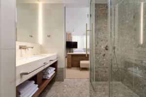 a bathroom with a shower and a sink at Grand Hotel View in Postira