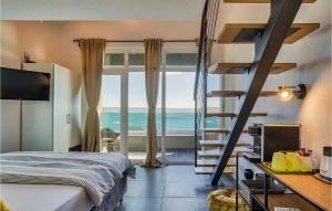 a bedroom with a bed and a view of the ocean at Villa Amy in Zadar