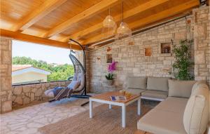 a living room with a stone wall at Villa Kalista Istriana in Pula +52 photos
